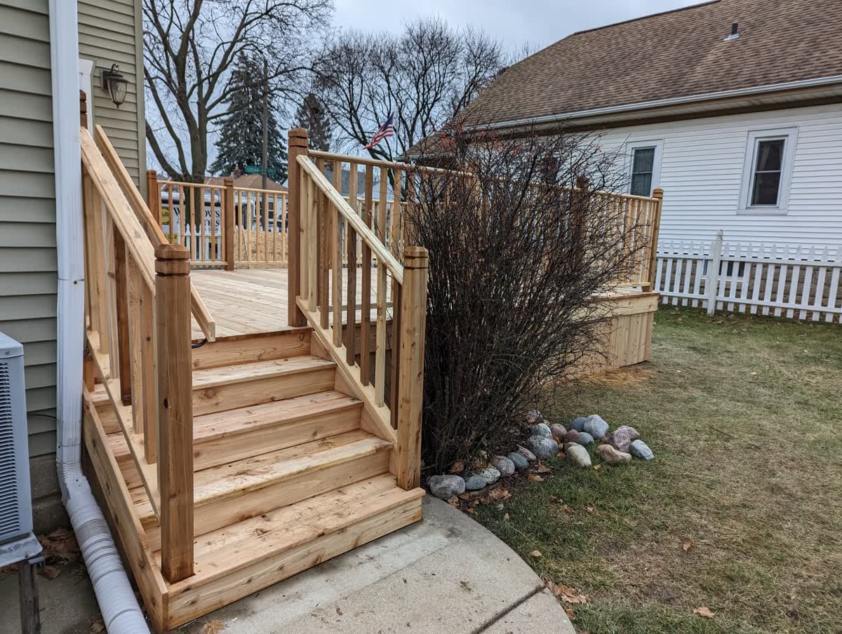 Newly built wood deck with stairs on a Southeast Wisconsin home
