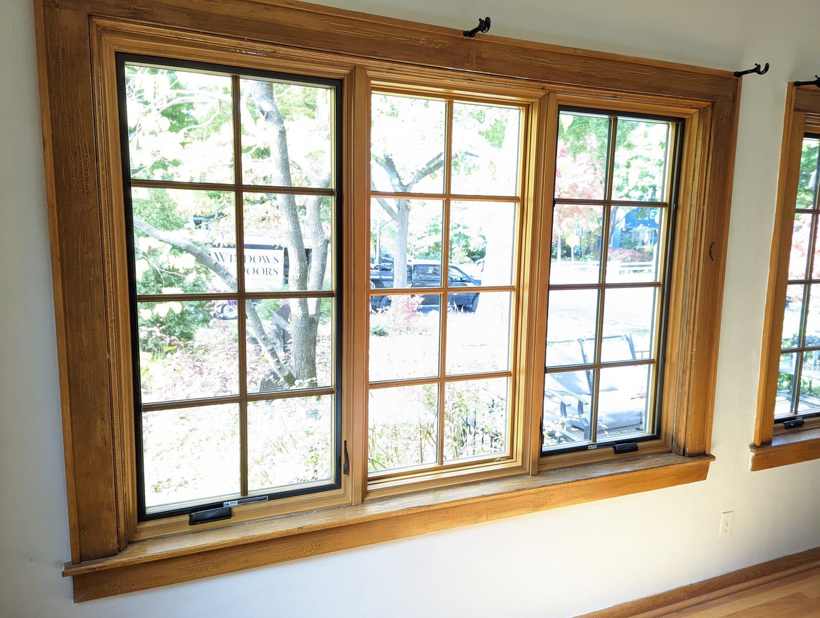 Wood-interior casement windows with colonial grilles in a Wisconsin home